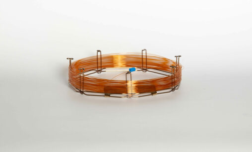 Gas chromatography capillary column made of wire held together by metal clips.