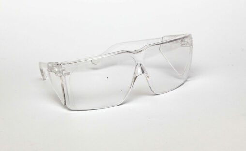 A pair of plastic safety glasses with a clear frame. The glasses shield the area around the eyes.