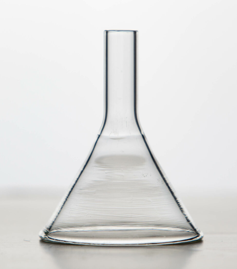 An upside down glass wide stem funnel.