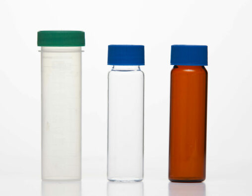 Three sample vials made of different materials (plastic, glass, and amber).